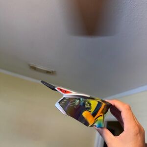 Oakley Silver Frame Sunglasses with Mirrored Multi-Color Lenses unfoldable